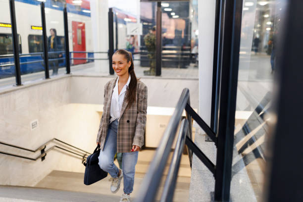 istock Young woman waiting train at station 2181756825