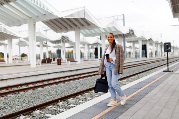 istock Young woman waiting train at station 2181756865