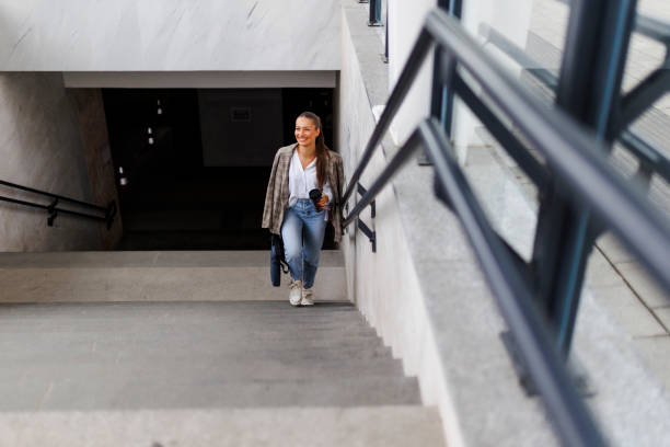 istock Young woman waiting train at station 2181757025