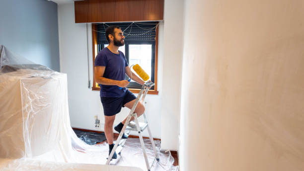 istock renovating and painting a house 2181759803