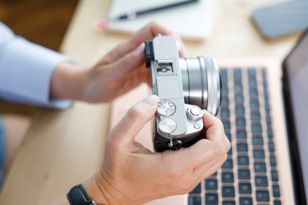 istock Woman checking photos on camera 2181760485