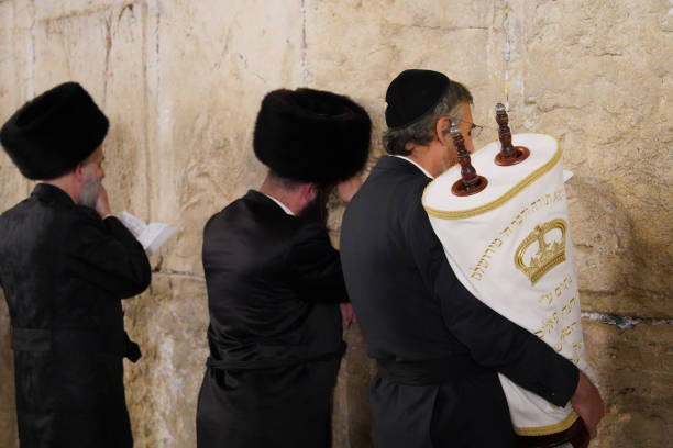 Jerusalem Israel 10/24/2024 Jews with a Torah scroll pray at the Western Wall in Jerusalem