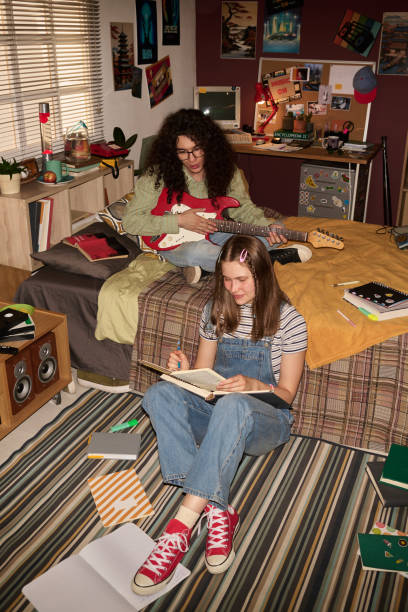 istock Studying and Playing Guitar in Cozy Bedroom 2181766907