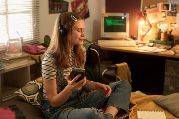 istock Enjoying Music in Cozy Bedroom Setting 2181766934
