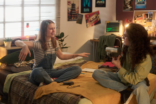 istock Conversing and Smiling with Friend in Cozy Bedroom 2181766975