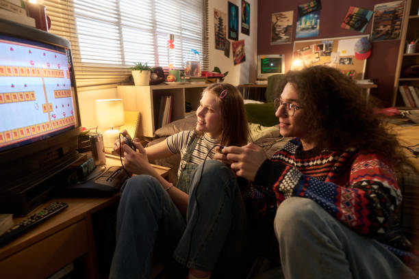 istock Enjoying Retro Gaming in Cozy Bedroom Setting 2181766988
