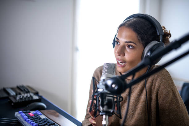 istock Woman recording a streaming podcast 2181768354