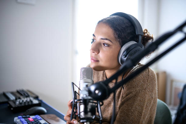 istock Woman recording a streaming podcast 2181768391