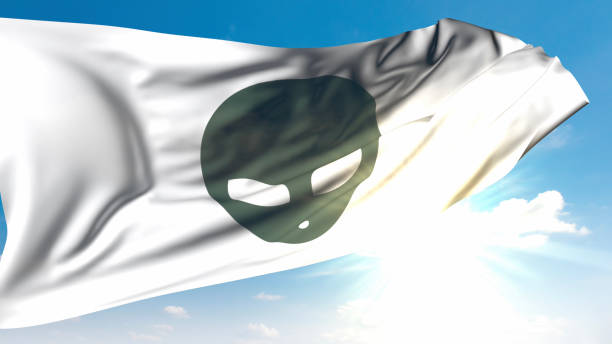 A flag with an alien symbol waving in the sky in Roswell, New Mexico, where the famous Roswell UFO crash took place and is a favorite spot for ufologists and UFO lovers. A gray alien with a bulb head is symbolized on the flag. / You can see the animation movie of this image from my iStock video portfolio. Video number: 2181702351