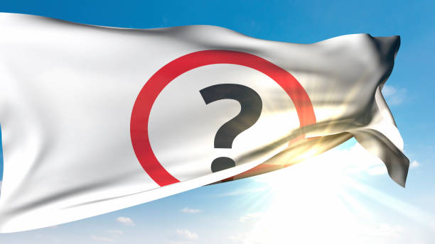 A white flag with a question mark symbol symbolizing the unknowns of life waves in the sunny sky. / You can see the animation movie of this image from my iStock video portfolio. Video number: 2181696929