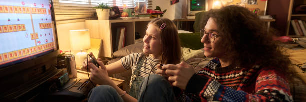 istock Enjoying a Classic Video Game Together in Cozy Room 2181769691