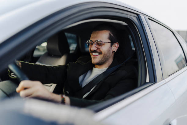 istock Happy man driving his car and smiling - transportation concepts 2181773054