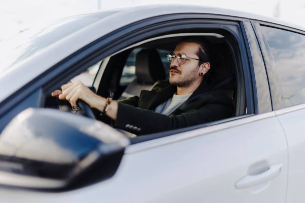 istock Happy man driving his car and smiling - transportation concepts 2181773231