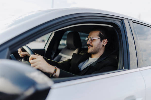 istock Happy man driving his car and smiling - transportation concepts 2181773291