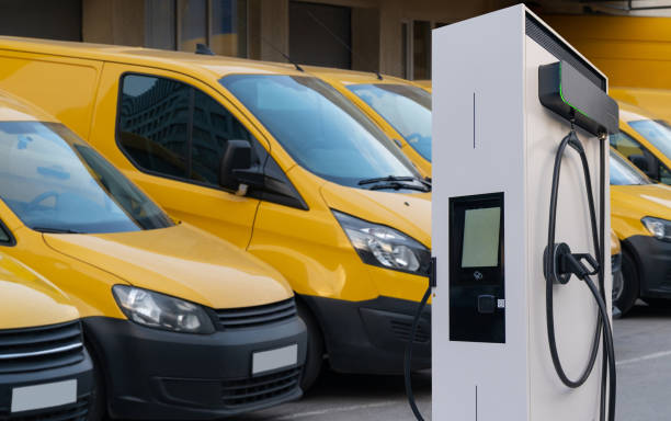 istock Electric delivery vans with electric vehicles charging station. 2181776745