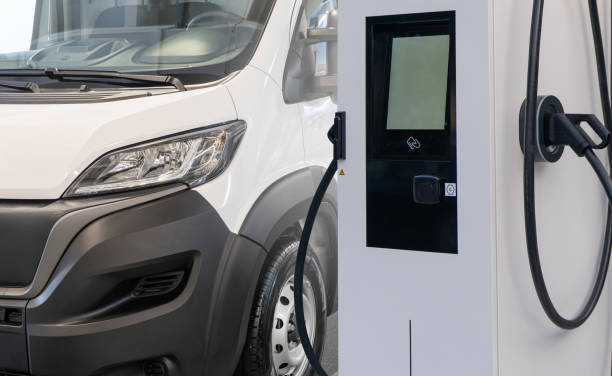 istock Electric delivery vans with electric vehicles charging station. 2181780296