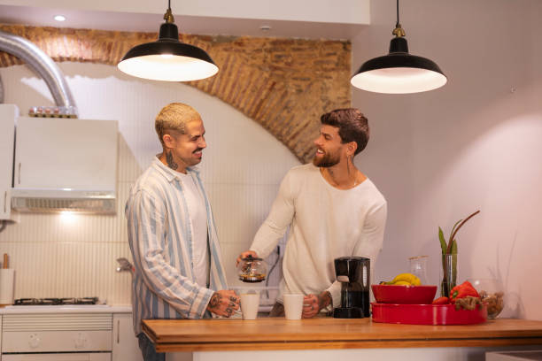 istock Gay couple preparing coffee together in the kitchen 2181782717
