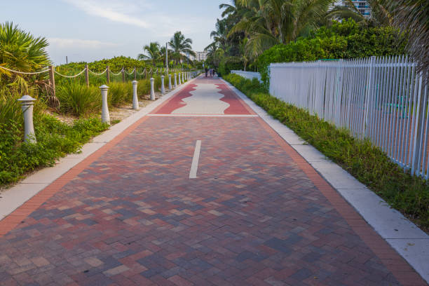 istock Paved walking path lined with greenery and lamp posts along Walking Street in Miami Beach. 2181782832