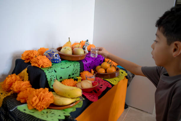 Child placing altar of the dead