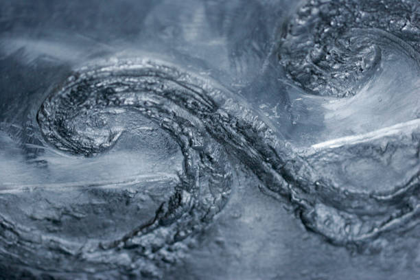 istock Hammered, Metallic, Silvery Blue Metal with Wave Closeup Texture Background 2181784322