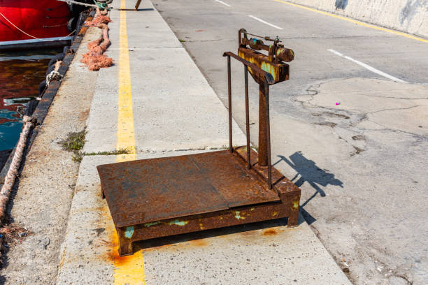 Old rusty mechanical beam weighing scales. Industrial scales
