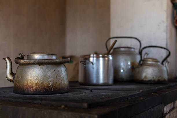 istock wood stove with various teapots 2181792150