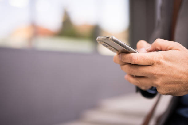 istock Close up of a businessman's hand using a smartphone 2181792328