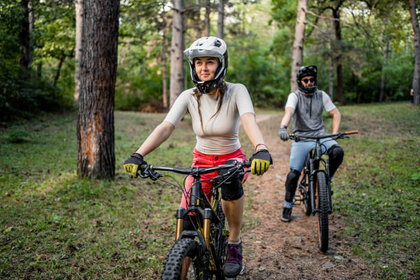 istock Cyclists rides mountain bikes through the woods 2181792364
