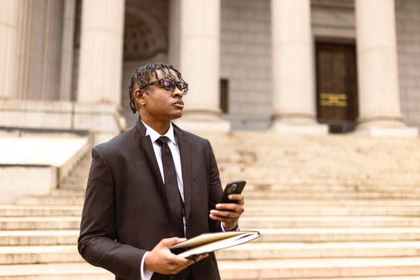 istock Professional Businessman with Smartphone and Documents Outside Government Building 2181796776
