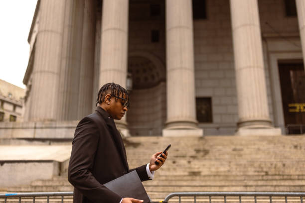 Businessman Using Smartphone Outside Government Building