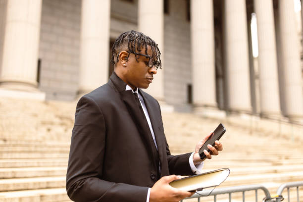 istock Lawyer Checking Smartphone Outside Courthouse 2181796797