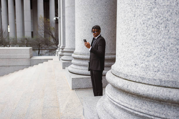 istock Businessman Checking Smartphone Outside Historic Building 2181796829
