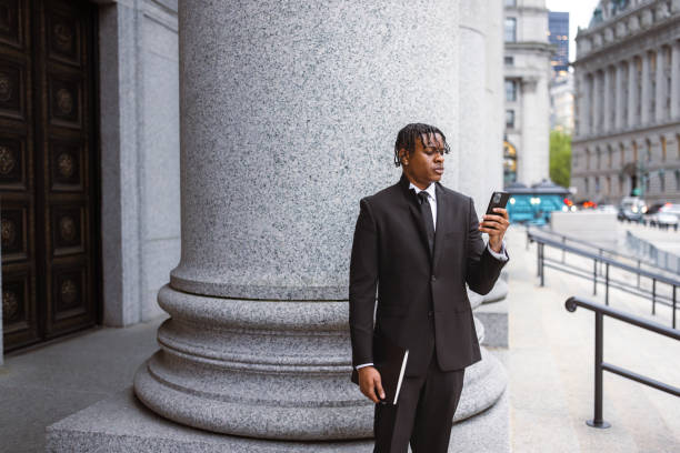 istock Business Professional Texting Outside Historic Building 2181796835