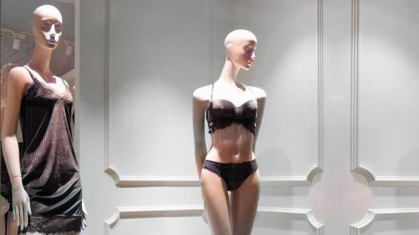 istock showroom dummies in shop window 2181796886