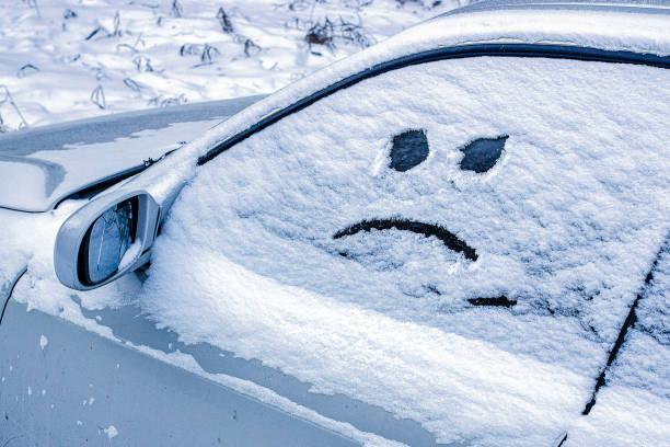 istock disgruntled smiley drawn on car windshield on cloudy winter day at sunset 2181797547