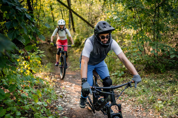 istock Cyclists rides mountain bikes through the woods 2181798183