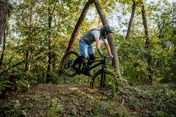 istock Mountain biker jumping and performing aerial maneuvers 2181798355