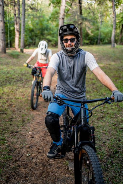 istock Cyclists rides mountain bikes through the woods 2181799593