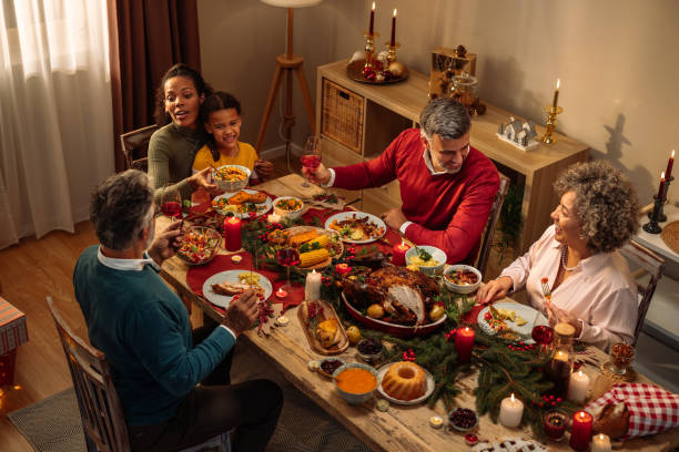 istock Smiling family enjoying Christmas dinner 2181801090