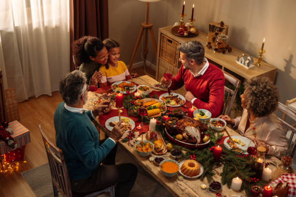 istock Multiethnic family enjoying Christmas dinner 2181801106