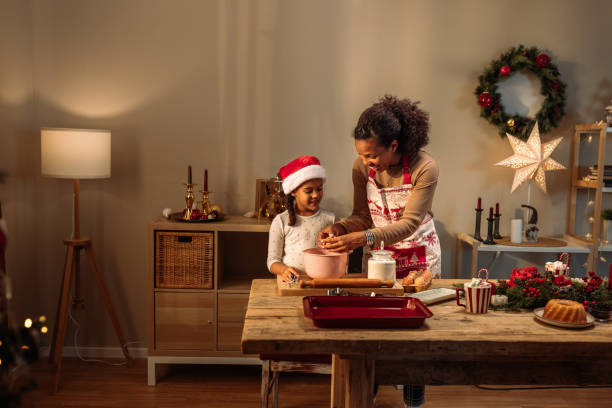 istock Mother and daughter making cookies together 2181801153