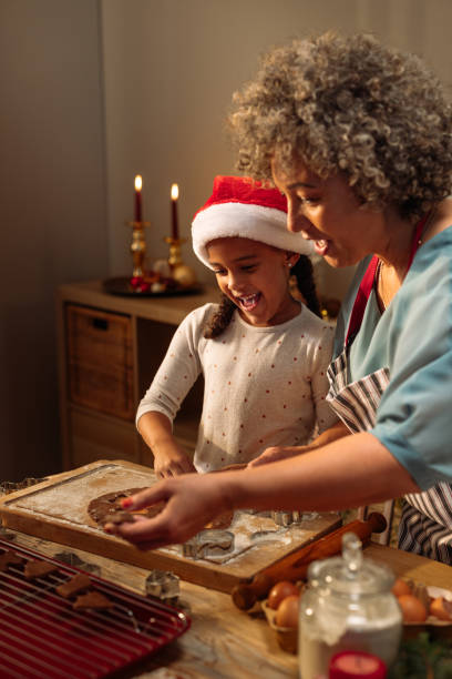 istock Grandma and grandchild making cookies 2181801173