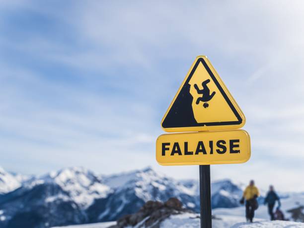 istock Cliff warning sign on snowy mountain trail 2181803204