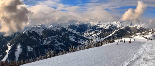 istock Clouds with trees and ski run in Austrian ski resort 2181804411
