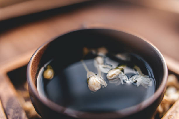 Dried jasmine tea in wooden box macrophotography