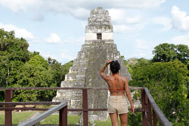 istock Tourist woman in Tikal pyramid 2181810565