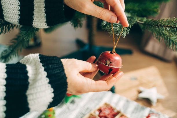 istock Red bell ornament hung on tree for Christmas season 2181811272