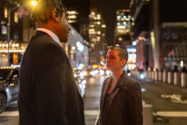 istock Urban Nighttime Conversation on Busy Street 2181811406