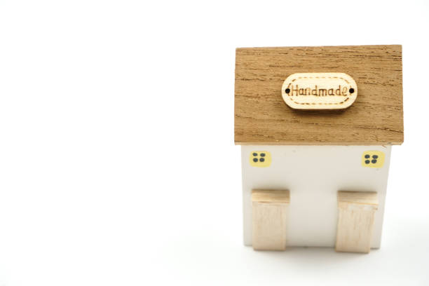 A charming wooden house model featuring a rustic design, perfect for home decor and creative projects.