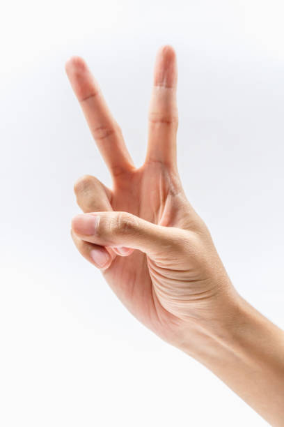 istock A hand displaying the peace sign, symbolizing harmony and goodwill. Ideal for themes of unity and positive communication. 2181812648